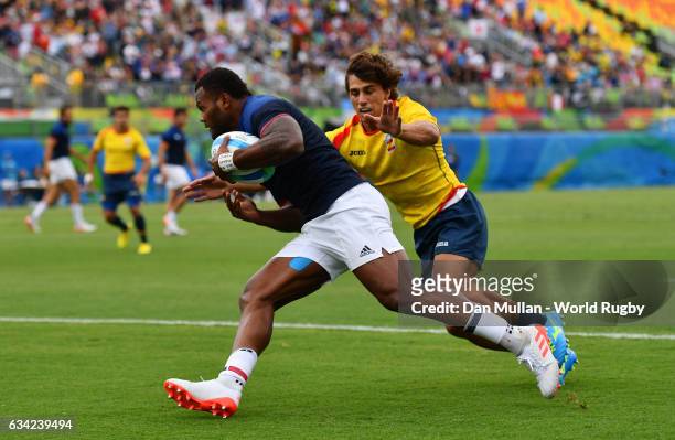 Virimi Vakatawa of France goes over for a try during the Men's Rugby Sevens Pool B match between France and Spain on Day five of the Rio 2016 Olympic...