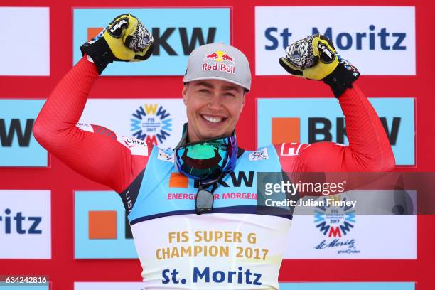 Gold medalist Erik Guay of Canada celebrates during the flower ceremony for the Men's Super G during the FIS Alpine World Ski Championships on...