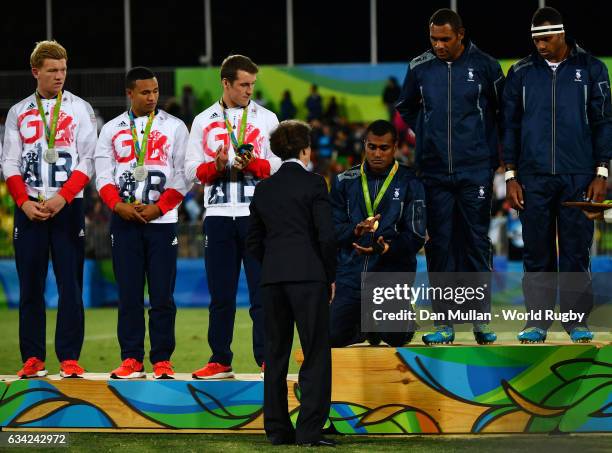 Princess Anne, Princess Royal presents Apisai Domolailai of Fiji with his gold medal following the Men's Rugby Sevens Gold Medal match between Fiji...