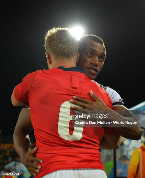 Tom Mitchell of Great Britain embraces Osea Kolinisau of Fiji following the Men's Rugby Sevens Gold Medal match between Fiji and Great Britain on day...
