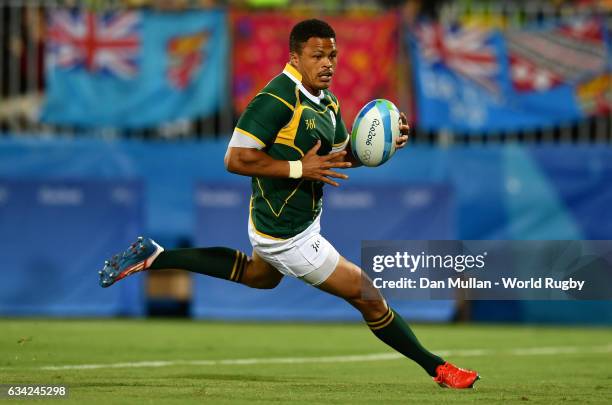 Juan de Jongh of South Africa runs in for a try during the Men's Rugby Sevens Bronze Medal match between Japan and South Africa on day six of the Rio...