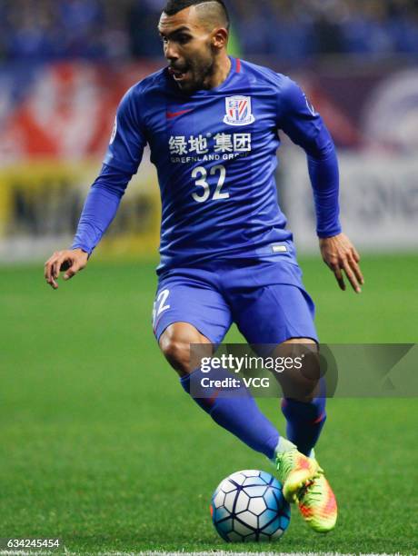 Carlos Tevez of Shanghai Shenhua drives the ball during the AFC Champions League 2017 play-off match between Shanghai Shenhua and Brisbane Roar at...