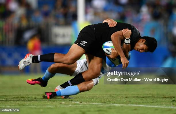 Reiko Ioane of New Zeland is tackled by Bautista Ezcurra of Argentina during the Men's Rugby Sevens placing match between New Zealand and Argentina...
