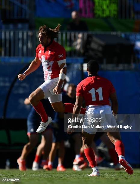 Dan Bibby of Great Britain celebrates victory at the final whistle during the Men's Rugby Sevens semi final match between Great Britain and South...