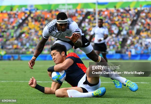 Kazushi Hano of Japan dives over for a try during the Men's Rugby Sevens semi final match between Fiji and Japan on day six of the Rio 2016 Olympic...
