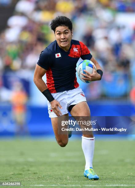 Kazushi Hano of Japan makes a break to score a try during the Men's Rugby Sevens semi final match between Fiji and Japan on day six of the Rio 2016...