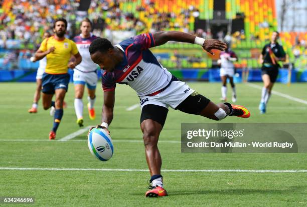Carlin Isles of the United States goes over for a try during the Men's Rugby Sevens placing match between the United States and Spain on day six of...