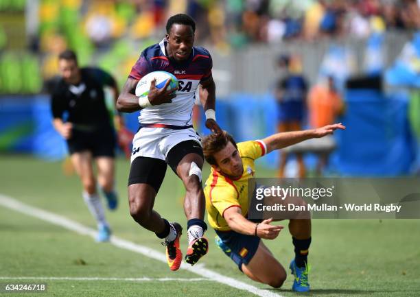 Carlin Isles of the United States makes a break past Marcos Poggi of Spain to score a try during the Men's Rugby Sevens placing match between the...