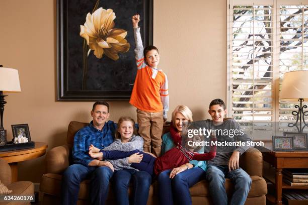 Stephanie Umberger and Jim Umberger are photographed with children Ari, Ethan, Isla and Alex for People Magazine on October 11, 2016 in Scottsdale,...