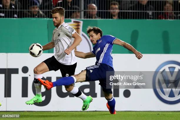 Lucas Hoeler of Sandhausen and Benjamin Stambouli of Schalke battle for the ball during the DFB Cup Round of16 match between SV Sandhausen and FC...