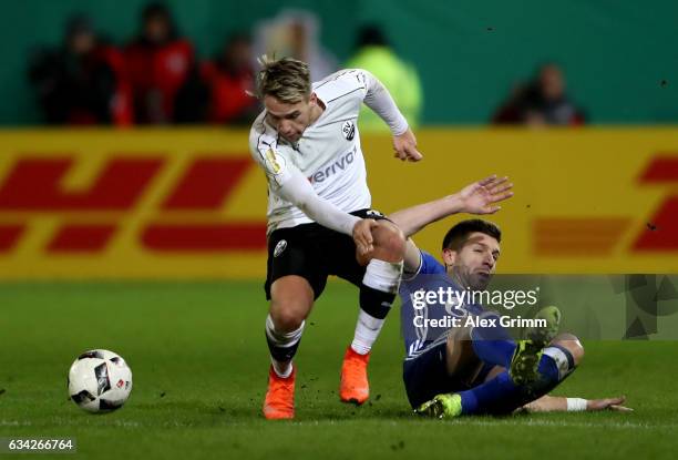 Thomas Pledl of Sandhausen and Matija Nastasic of Schalke battle for the ball during the DFB Cup Round of16 match between SV Sandhausen and FC...