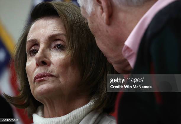 House Minority Leader Nancy Pelosi confers with Rep. Steny Hoyer while attending an opening news conference during the House Democratic caucus...