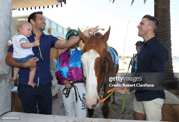 Hawthorn Hawks footballer Luke Hodge and Carlton Blues footballer Marc Murphy pose with Apache Cat during the Festival of Racing Media Launch the the...