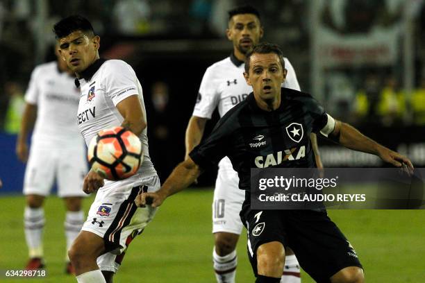 Brazil's Botafogo player Walter Montillo vies for the ball with Chile's Colo-Colo player Esteban Pavez during their Copa Libertadores football match...