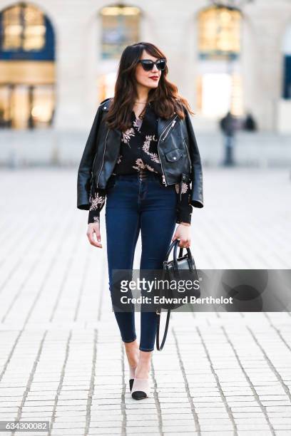Sarah Benziane, fashion blogger from Les Colonnes de Sarah, wears Newlook white shoes with black heels, Newlook blue denim jeans, a Newlook black...