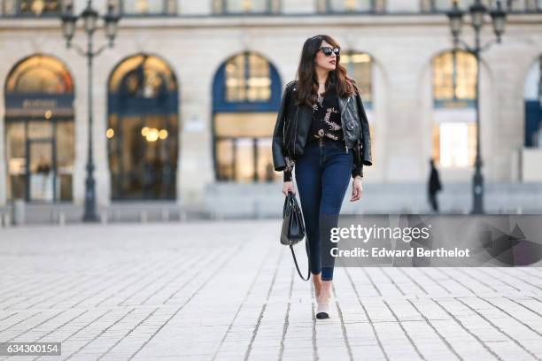 Sarah Benziane, fashion blogger from Les Colonnes de Sarah, wears Newlook white shoes with black heels, Newlook blue denim jeans, a Newlook black...