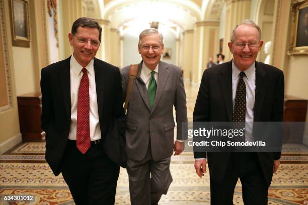 Sen. John Barrasso , Senate Majority Leader Mitch McConnell and Sen. Lamar Alexander walk thorugh the U.S. Captiol after the Senate confirmed Sen....