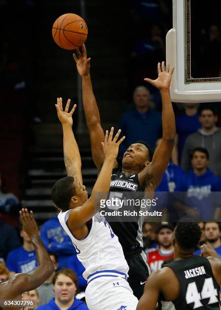 Rodney Bullock of the Providence Friars blocks a shot by Desi Rodriguez of the Seton Hall Pirates during the first half of an NCAA college basketball...