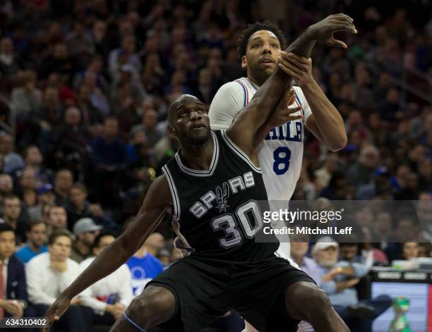 Joel Anthony of the San Antonio Spurs boxes out Jahlil Okafor of the Philadelphia 76ers in the fourth quarter at the Wells Fargo Center on February...
