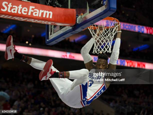 Robert Covington of the Philadelphia 76ers dunks the ball against the San Antonio Spurs in the third quarter at the Wells Fargo Center on February 8,...