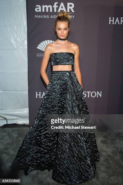 Model Bridget Malcolm attends the 19th Annual amfAR New York Gala at Cipriani Wall Street on February 8, 2017 in New York City.