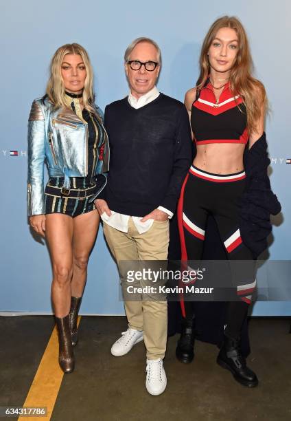 Recording artist Fergie, fashion designer Tommy Hilfiger and model Gigi Hadid pose at the TommyLand Tommy Hilfiger Spring 2017 Fashion Show on...