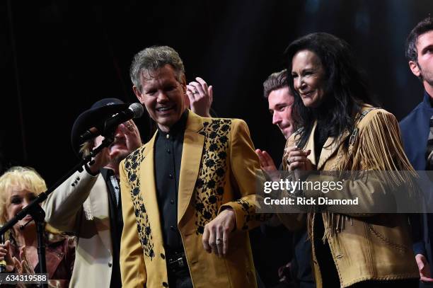 Randy Travis and Mary Travis perform during 1 Night. 1 Place. 1 Time: A Heroes & Friends Tribute to Randy Travis at Bridgestone Arena on February 8,...