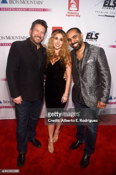 Producer John Burk, singer Haley Reinhart and musician Lawrence 'Boo' Mitchell attend the P&E Wing Event honoring Jack White at The Village Studios...