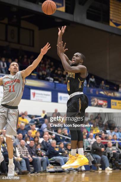 Kent State Golden Flashes G Jalen Avery shoots as Bowling Green Falcons G Antwon Lillard defends during the second half of the men's college...