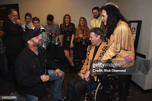 Garth Brooks speaks backstage with Randy Travis and Mary Travis during 1 Night. 1 Place. 1 Time: A Heroes & Friends Tribute to Randy Travis at...