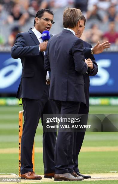 This photo taken on December 27 shows former Pakistan fast bowler and Channel Nine cricket commentator Waqar Younis with fellow commentators Mark...