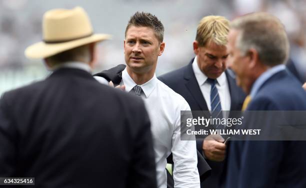 This photo taken on December 27, 2016 shows former Australian cricket captain and now Channel Nine cricket commentator Michael Clarke with fellow...
