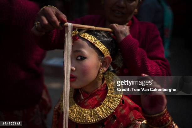 Young Nepalese girl dressed up as a bride to take part in the Bel Bibaha ritual, celebrated by the Newari ethnicity, indigenous to the Kathmandu...