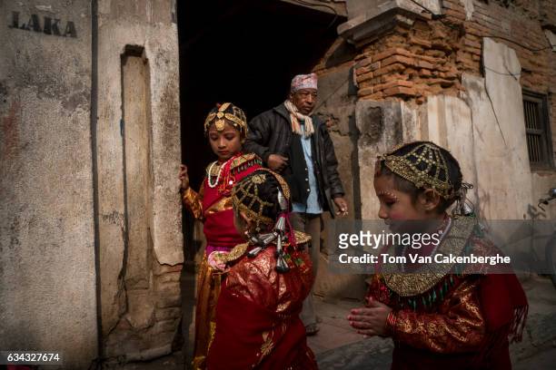 Young Nepalese girls dressed as brides take part in the Bel Bibaha ritual, celebrated by the Newari ethnicity, indigenous to the Kathmandu Valley on...