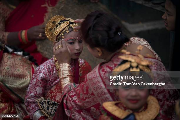 Young Nepalese girls dressed up as brides take part in the Bel Bibaha ritual, celebrated by the Newari ethnicity, indigenous to the Kathmandu Valley...