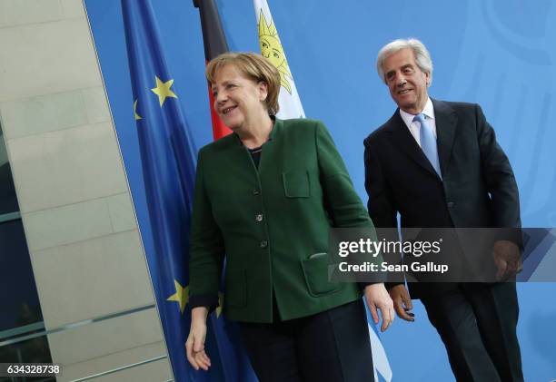 German Chancellor Angela Merkel and Uruguayan President Tabare Vazquez depart after speaking to the media following talks at the Chancellery on...