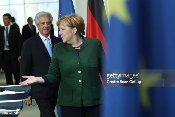 German Chancellor Angela Merkel and Uruguayan President Tabare Vazquez arrive to speak to the media following talks at the Chancellery on February 8,...