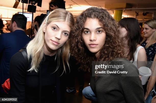 Devon Windsor and Pauline Hoarau attends the Tommy Hilfiger Spring 2017 Women's Runway Show - Backstage at Windward Plaza on February 8, 2017 in...