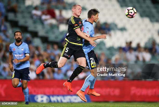 Ryan Lowry of Wellington Phoenix competes for the ball against Filip Holosko of Sydney FC during the round 19 A-League match between Sydney FC and...
