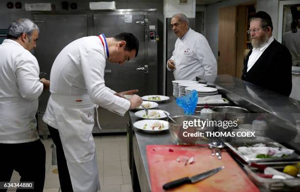 Top French chef Laurent Delarbre helps to to prepare a kosher menu, under the supervision of a rabi , during the "So French, so Food", a week...
