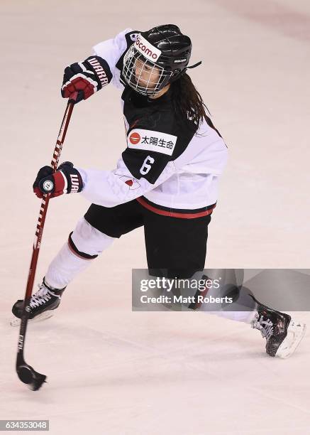 Sena Suzuki of Japan passes the puck during the Women's Ice Hockey Olympic Qualification Final game between Austria and Japan at Hakucho Arena on...