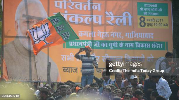 Indian supporters of the Bharatiya Janata Party listen as Prime Minister Narendra Modi speaks during a election rally in Ghaziabad.