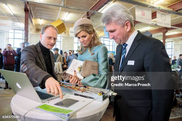 Queen Maxima Of The Netherlands accompanied by Prof. Andreas Pinkwart of the HHL Leipzig Graduate School of Management talks to a young entrepreneur...