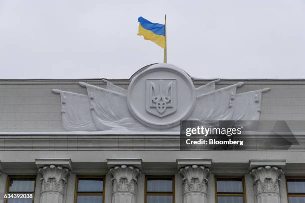 National flag of Ukraine flies above the headquarters of Ukraine's finance ministry in Kiev, Ukraine, on Wednesday, Feb. 2017. Creditors of Ukraines...