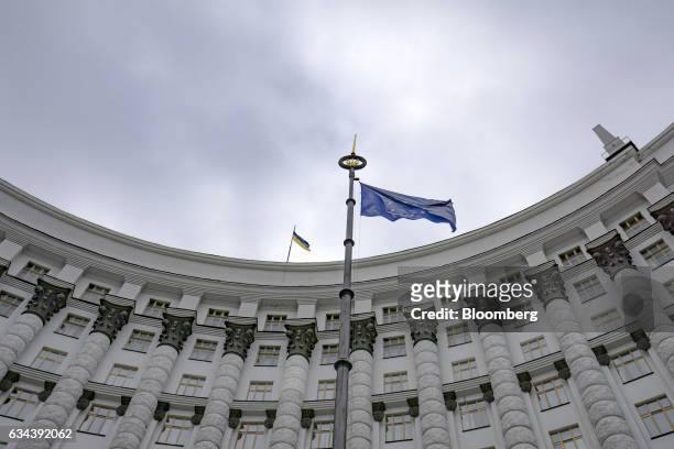 The flag of the European Union flies outside the headquarters of Ukraine's finance ministry in Kiev, Ukraine, on Wednesday, Feb. 2017. Creditors of...