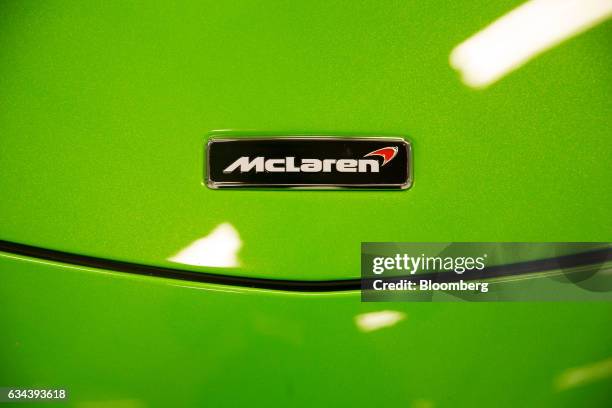 The McLaren Automotive Ltd. Logo sits a 570S automobile during a news conference announcing the company's building of a plant in Sheffield, U.K., on...