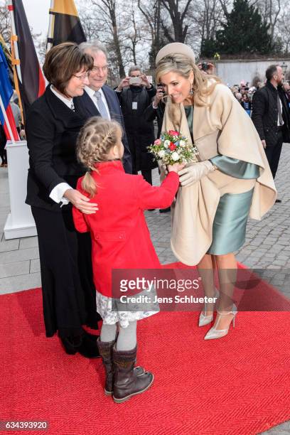 Queen Maxima of the Netherlands gets flowers from Magdalena Guenther on February 9, 2017 in Wittenberg, Germany, beside stand Reiner Haseloff,...