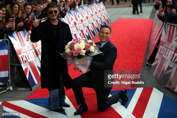 Judges Simon Cowell and David Walliams arrive for the Britain's Got Talent Manchester auditions on February 9, 2017 in Manchester, United Kingdom.
