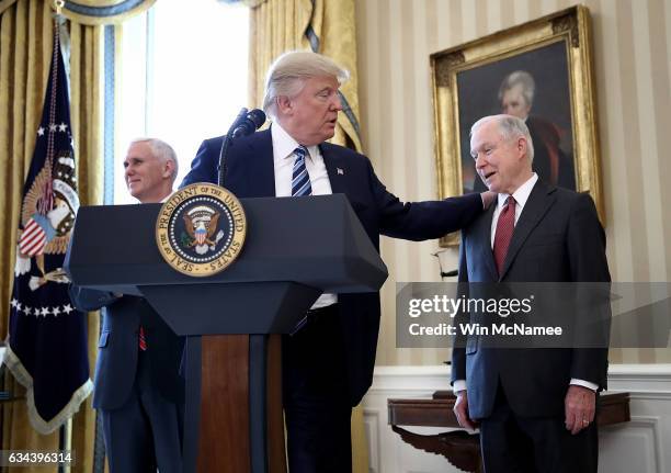 President Donald Trump put his hand on the shoulder of Sen. Jeff Sessions after introducing him before Sessions's swearing in ceremony in the Oval...