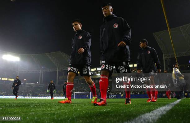 Angel Uribe and Antonio Nava of Club Tijuana make their way to the bench for the friendly match against the Los Angeles Galaxy at StubHub Center on...